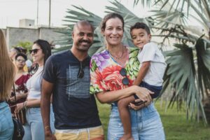 Brazilian family posing - father and mother holding their son, locate birth parents in Brazil concept