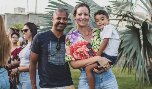 Brazilian family posing - father and mother holding their son, locate birth parents in Brazil concept