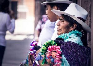 Mexican mother wearing traditional Mexican clothes, locate birth parents in Mexico concept