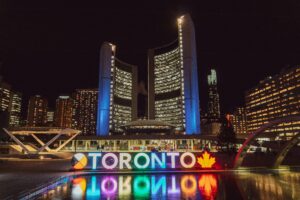 buildings at night in Toronto, Canada; skip tracing services in Canada