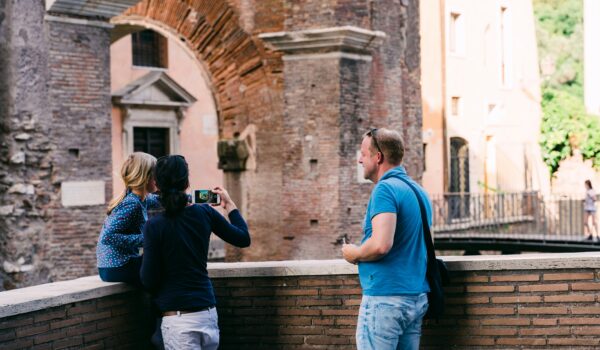 Italian family of three taking pictures in Rome; locate birth parents in Italy concept