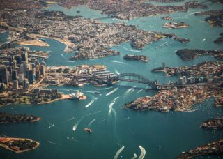 aerial view of Sydney Harbor in Australia; skip tracing services in Australia