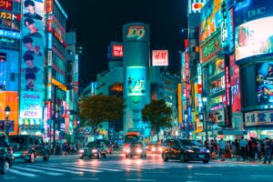 Shibuya crossing at night in Japan; skip tracing services in Japan concept