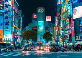 Shibuya crossing at night in Japan; skip tracing services in Japan concept