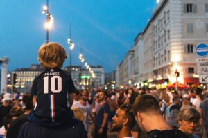 French people gathered in a public place; locate birth parents in France concept