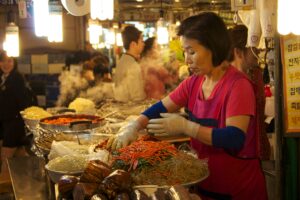 South Korean mother selling Korean food in the market; locate birth parents in South Korea