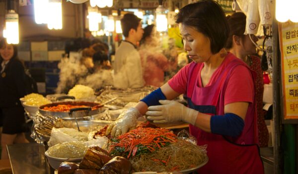 South Korean mother selling Korean food in the market; locate birth parents in South Korea