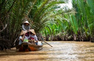 Vietnamese family on a canoe; locate birth parents in Vietnam