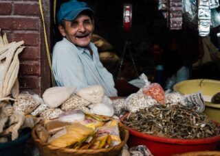 Honduran grandfather in his shop in Santa Rosa de Copán, Honduras; locate birth parents in Honduras concept