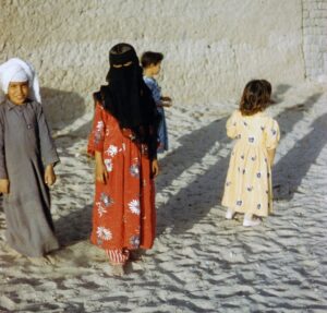 two Kuwaiti kids smiling for the camera; locate birth parents in Kuwait concept