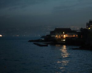 Beirut, Lebanon at night shot from the sea; skip tracing services in Lebanon concept