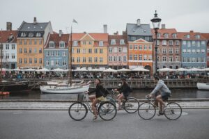 Danish siblings riding their bicycles in Copenhagen, Denmark; locate birth parents in Denmark concept