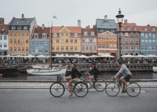 Danish siblings riding their bicycles in Copenhagen, Denmark; locate birth parents in Denmark concept