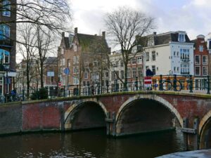 old brick bridge in Amsterdam, Netherlands; skip tracing services in Netherlands concept