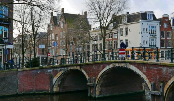 old brick bridge in Amsterdam, Netherlands; skip tracing services in Netherlands concept