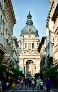 people walking on the street in Budapest, Hungary; locate birth parents in Hungary concept