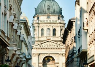 people walking on the street in Budapest, Hungary; locate birth parents in Hungary concept