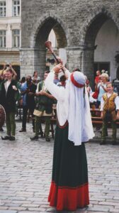 people celebrating in Old Town of Tallinn, Tallinn, Estonia; locate birth parents in Estonia concept