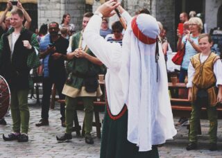 people celebrating in Old Town of Tallinn, Tallinn, Estonia; locate birth parents in Estonia concept