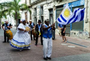 Afro-Uruguayan celebrating in the streets of Montevideo, Uruguay; locate birth parents in Uruguay concept