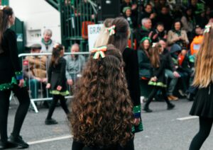 Irish girls in a parade during St. Patrick's Day; locate birth parents in Ireland concept