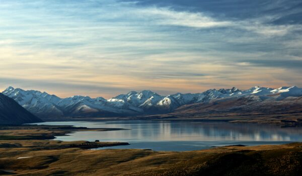 lake and mountains on the horizon of New Zealand; skip tracing services in New Zealand concept