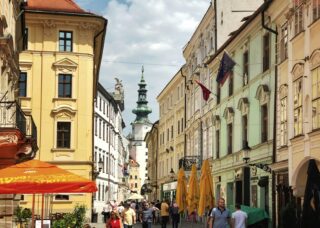 people walking in the streets of Bratislava, Slovakia; locate birth parents in Slovakia